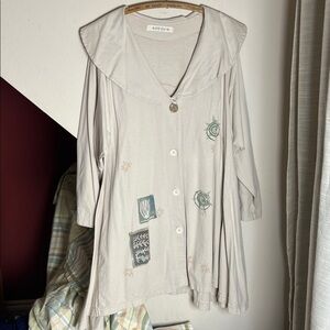 Blue Fish Artist Graphic Tunic Top Beige Oversized Collar Button Front